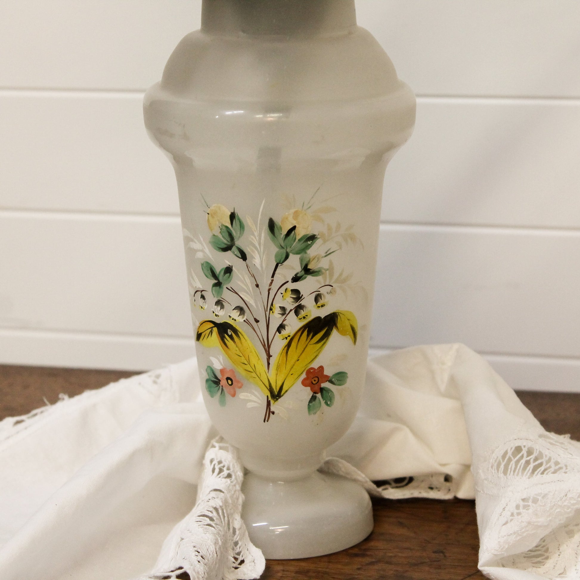 Decorative vase with floral design on a white background